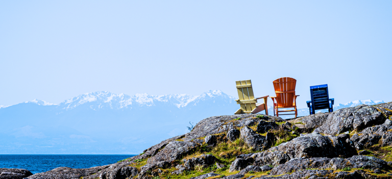 Three chairs overlooking the mountains representing that there is always three people in a spiritual direction session.